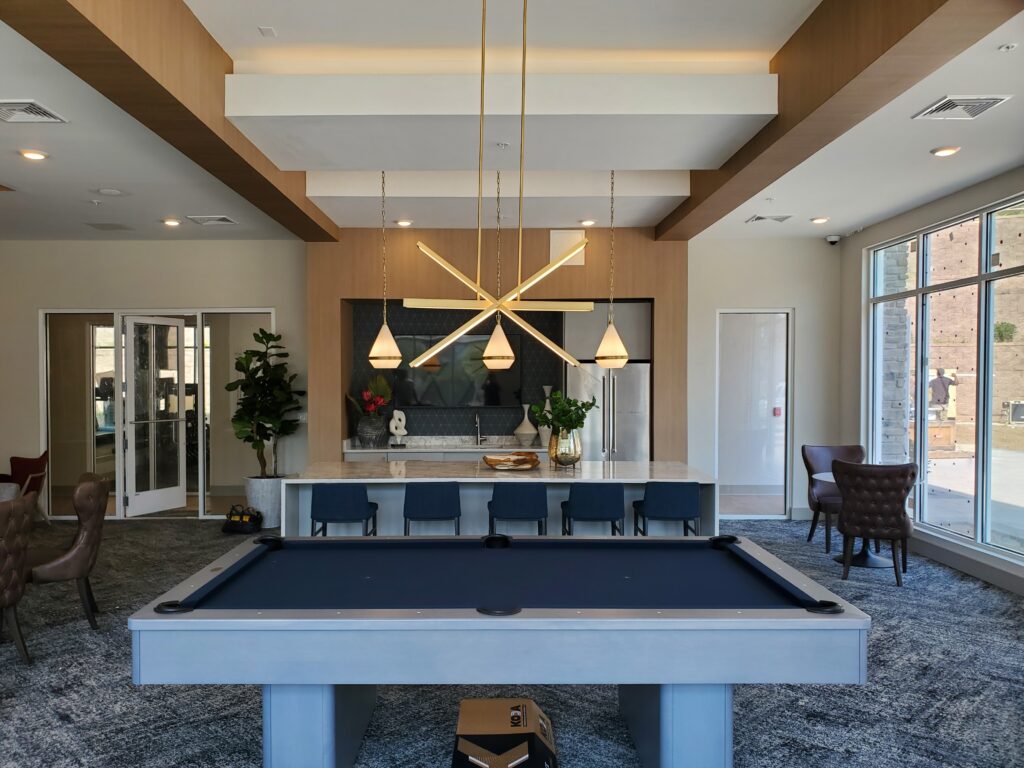 Stylish lounge with a billiards table and modern lighting in Kenvil, NJ.