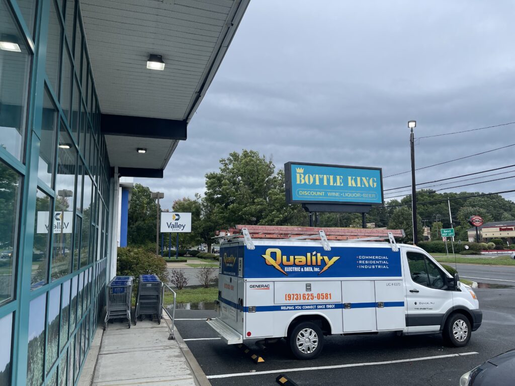 Quality Electric service van parked in front of Bottle King in Roxbury, NJ.
